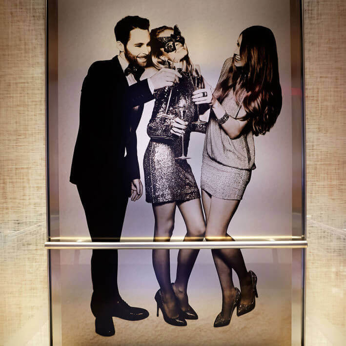 Image of People at a Party Printed on Metal Paneling inside an elevator in New York C.ity